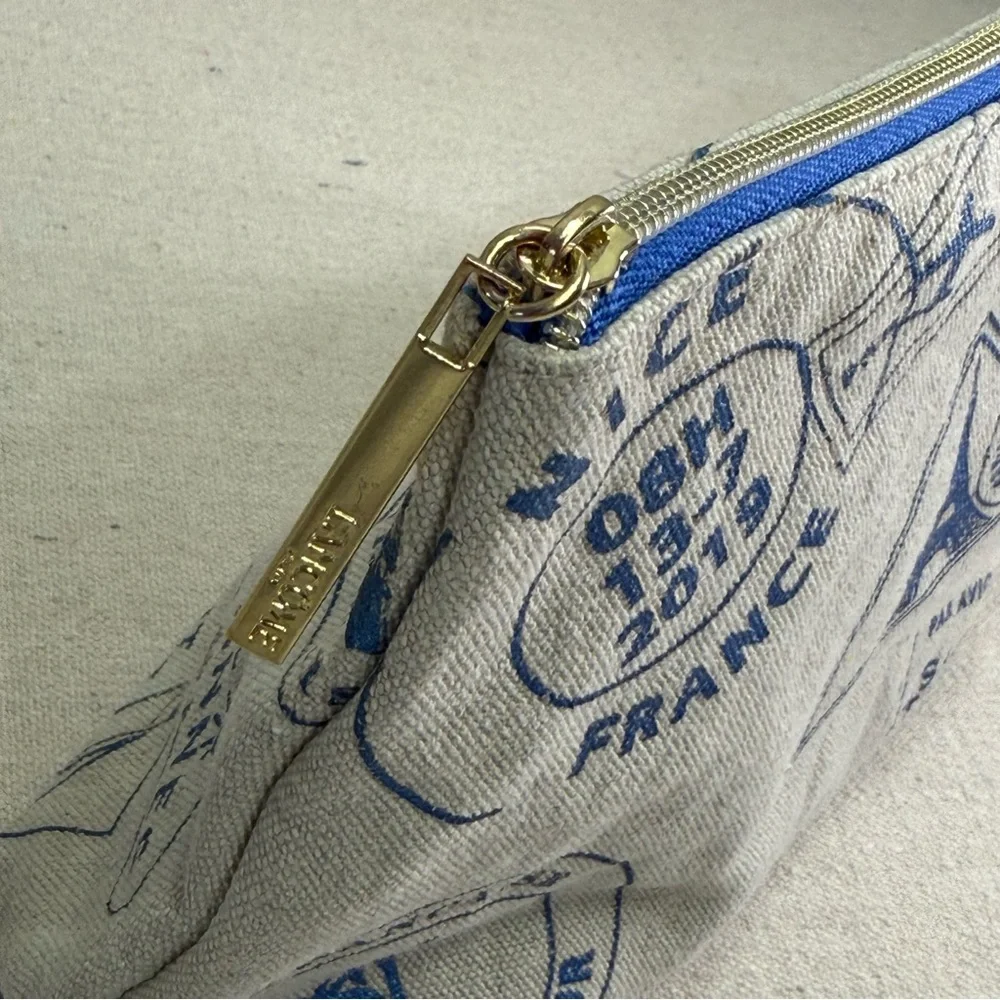Lancôme Paris canvas cosmetic bag - blue passport stamp design